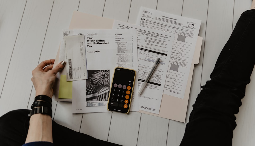 Lawyer's desk with scattered legal papers and a focused professional